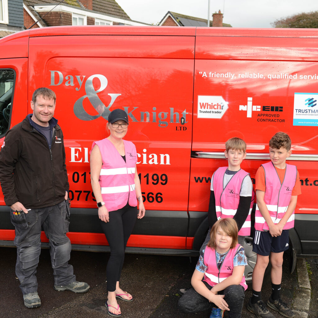 Day and Knight Ltd ref van, director David Knight with Lisa Thompson, Zach Thompson, William Knight and Jacob Knight wearing the high visability vests donated to the Mini Bloomers